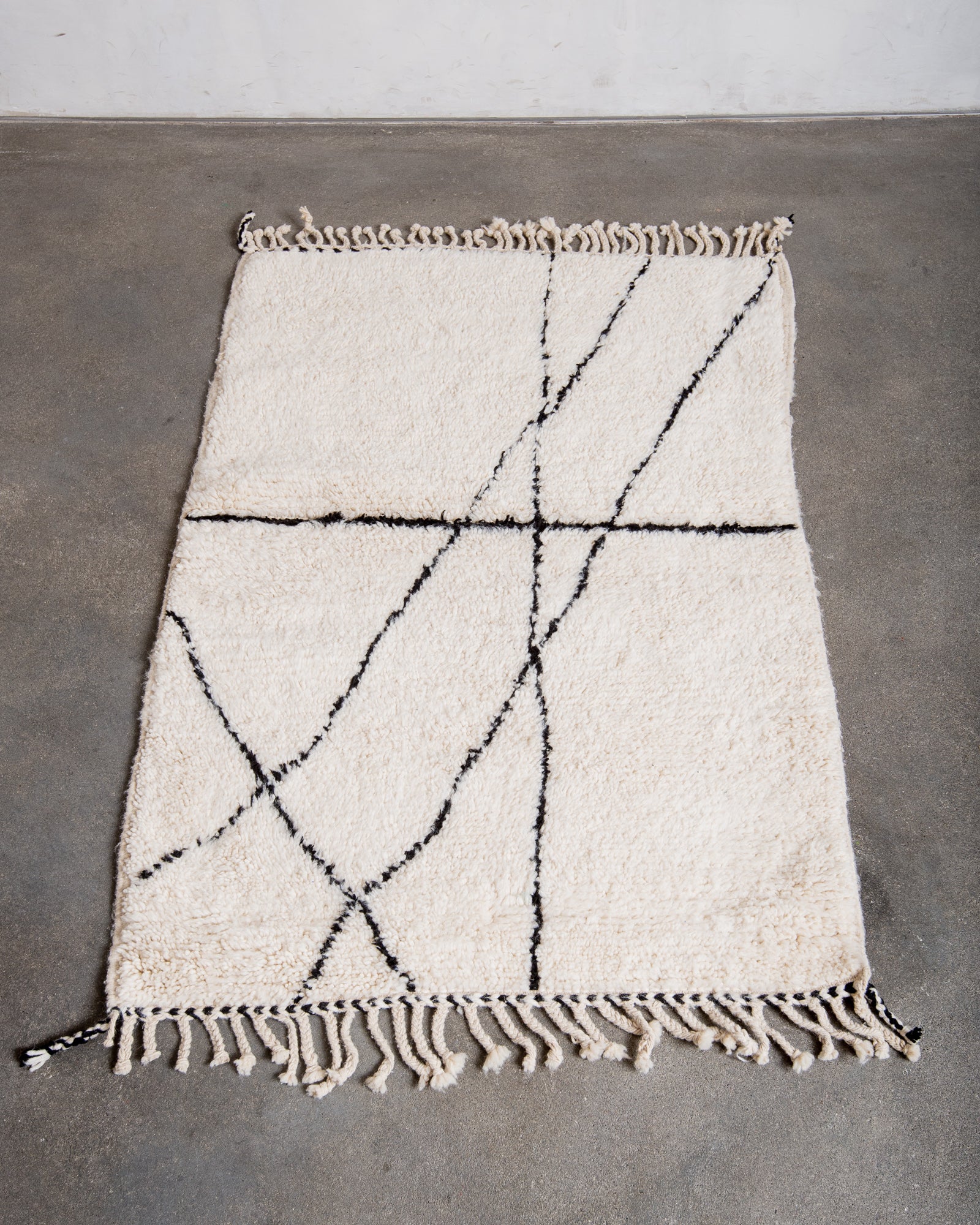 Modern, designer, handcrafted Berber rug from Morocco. Beniourain carpet with minimalist design, natural wool pile and a fluffy texture.